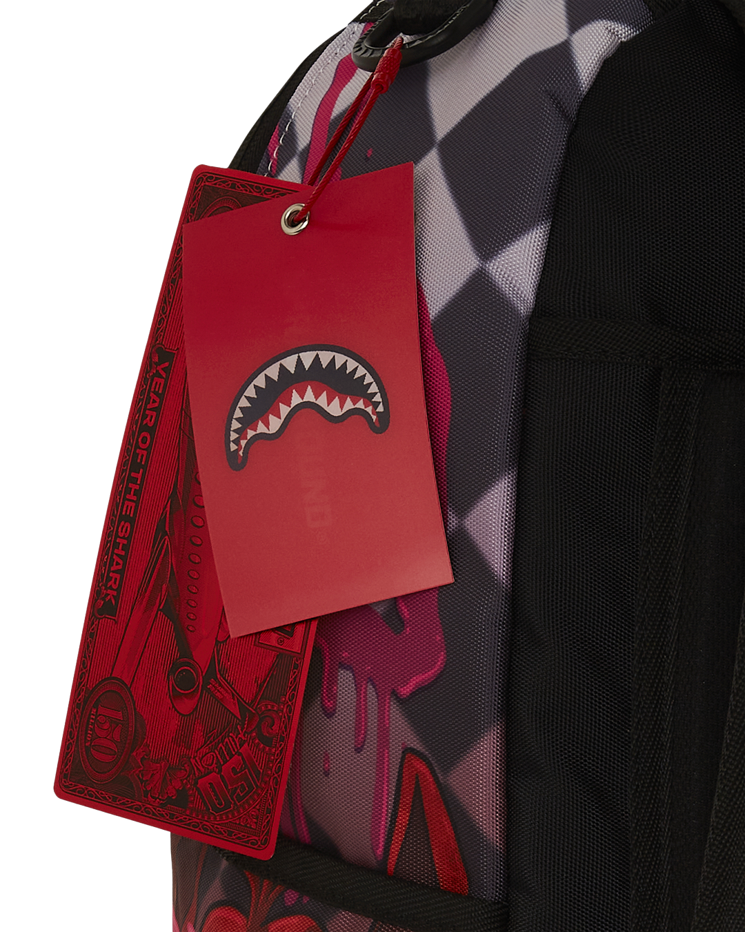 Top-down angle highlighting velour laptop sleeve and internal mesh organizer of the Sprayground backpack