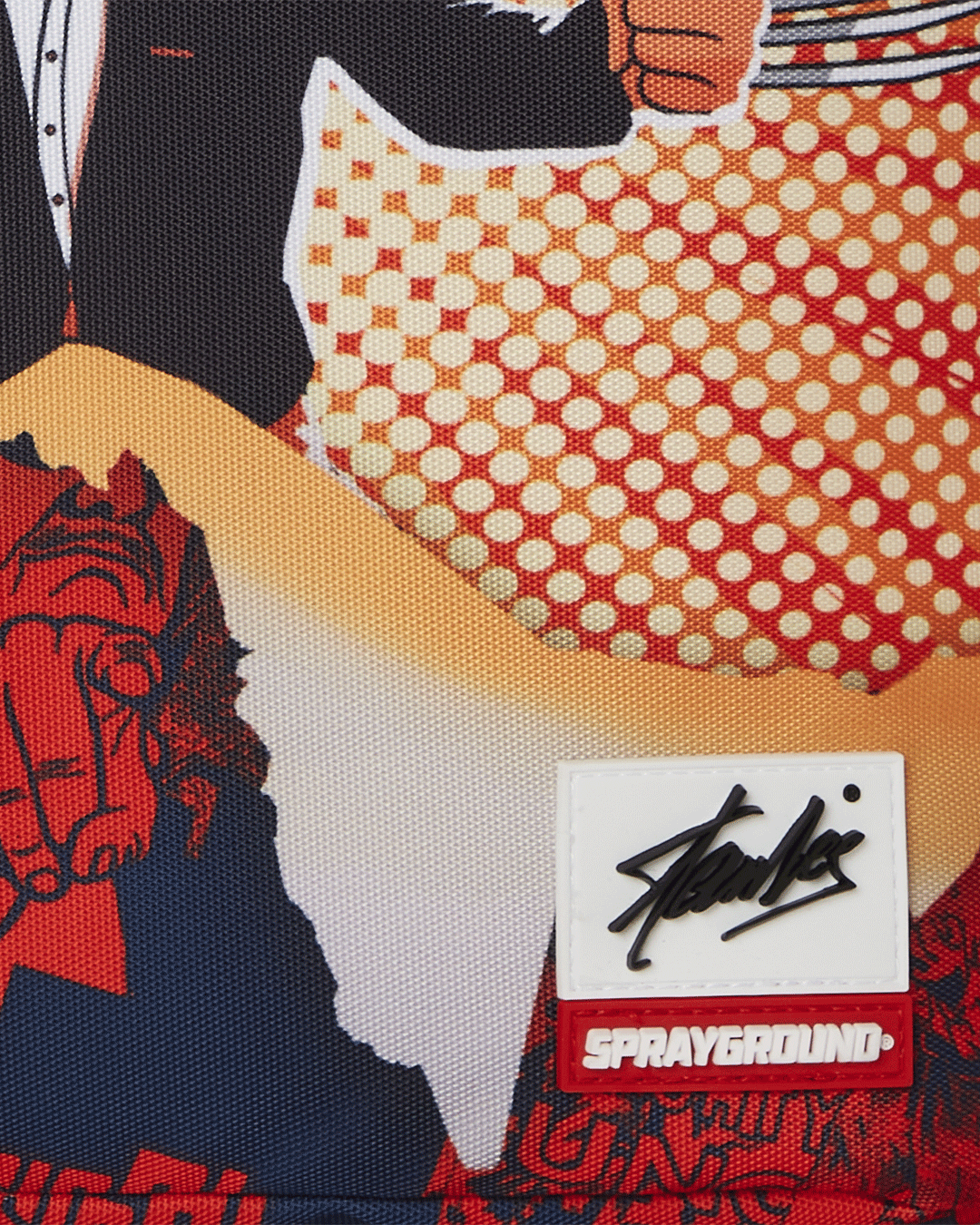 Close-up of Stan Lee artwork on pink Sprayground backpack with side pockets visible