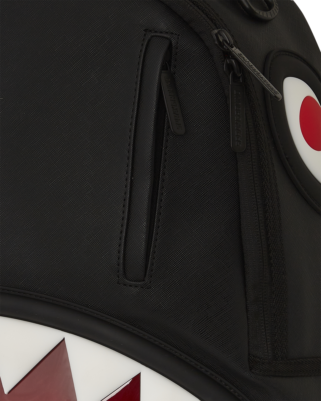 Side angle showing faux leather straps and ergonomic mesh padding