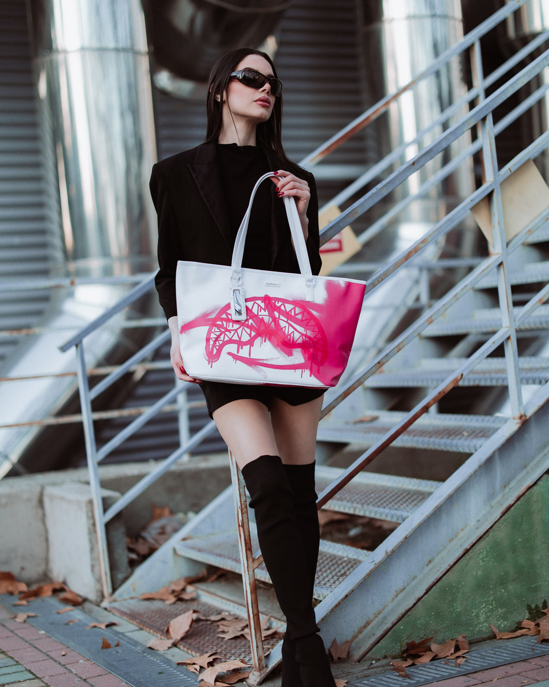Front view of the faux leather tote bag with double handles and top zipper