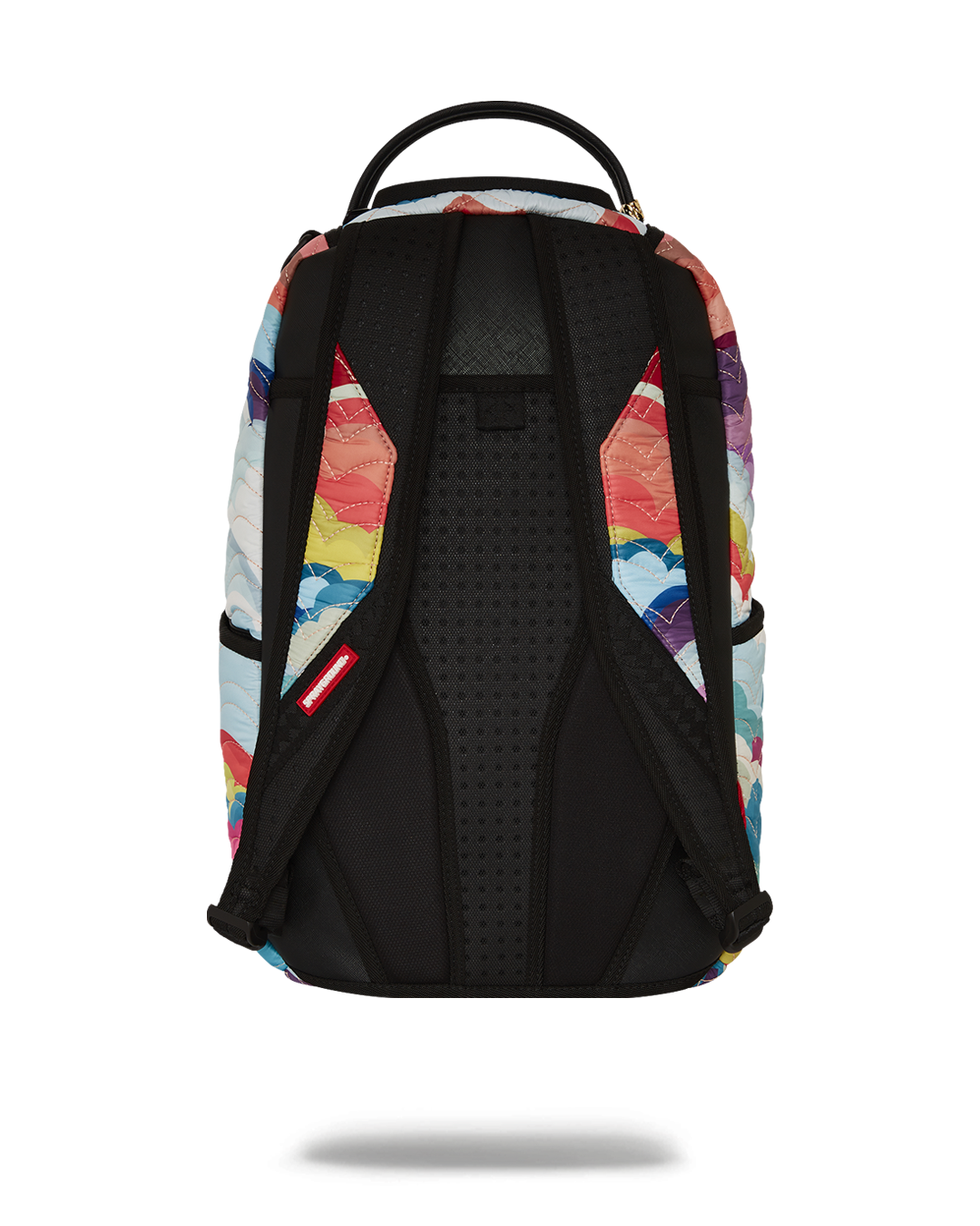 Rainbow quilted backpack worn over shoulders, showcasing cloud detailing and side pockets