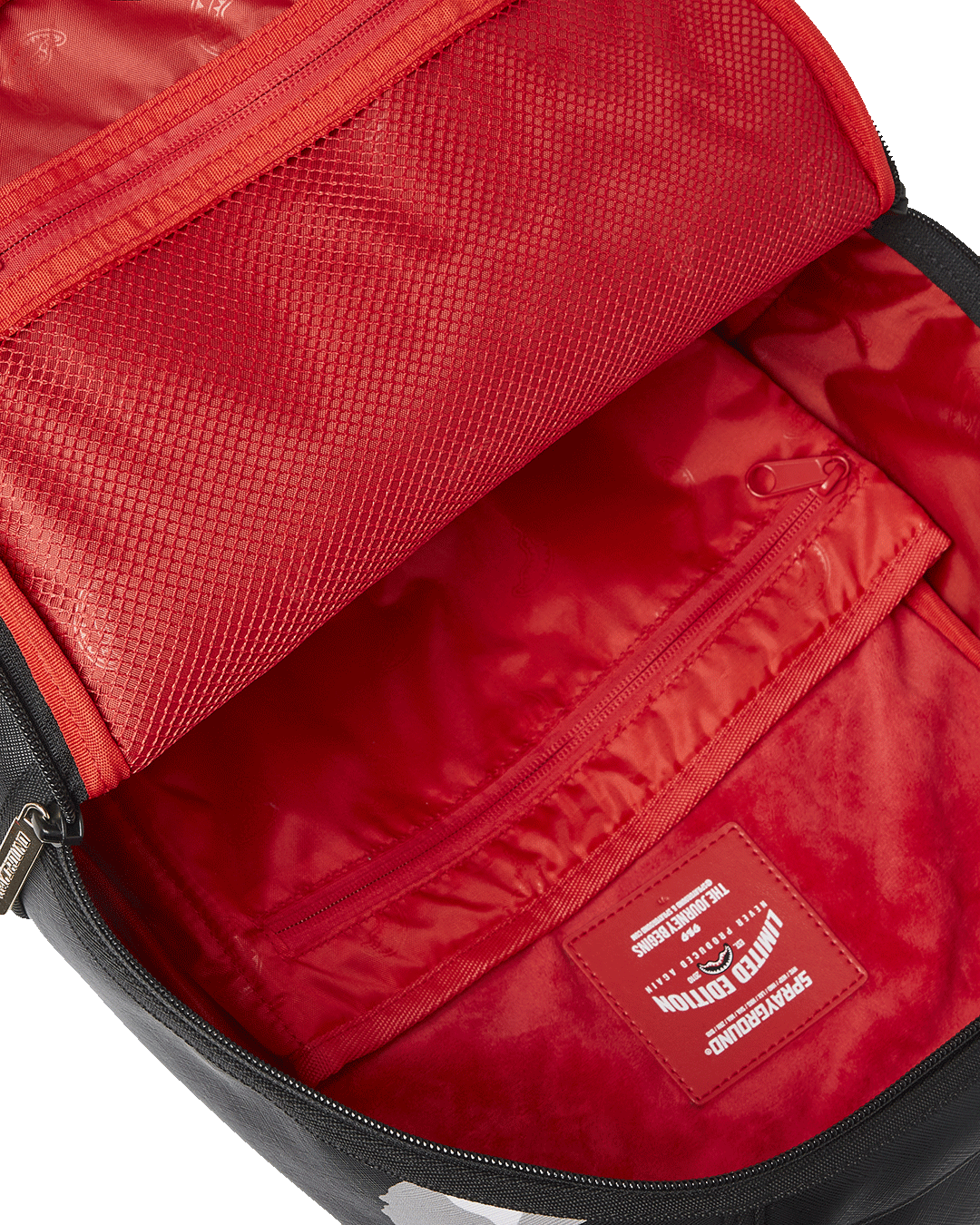 Model wearing Sprayground backpack with ergonomic straps in urban setting.