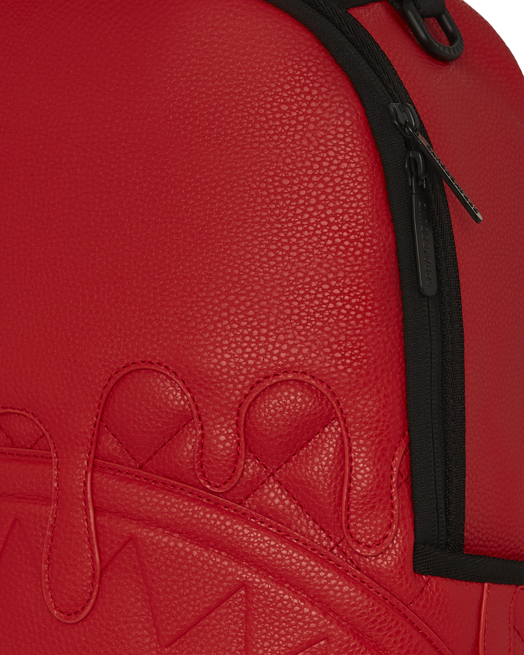 Open backpack showing velour laptop and sunglass compartments with organized mesh pocket.