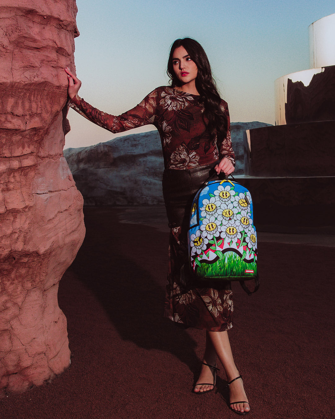Back view of the Sprayground Crazy Daisy Backpack showing ergonomic mesh back padding
