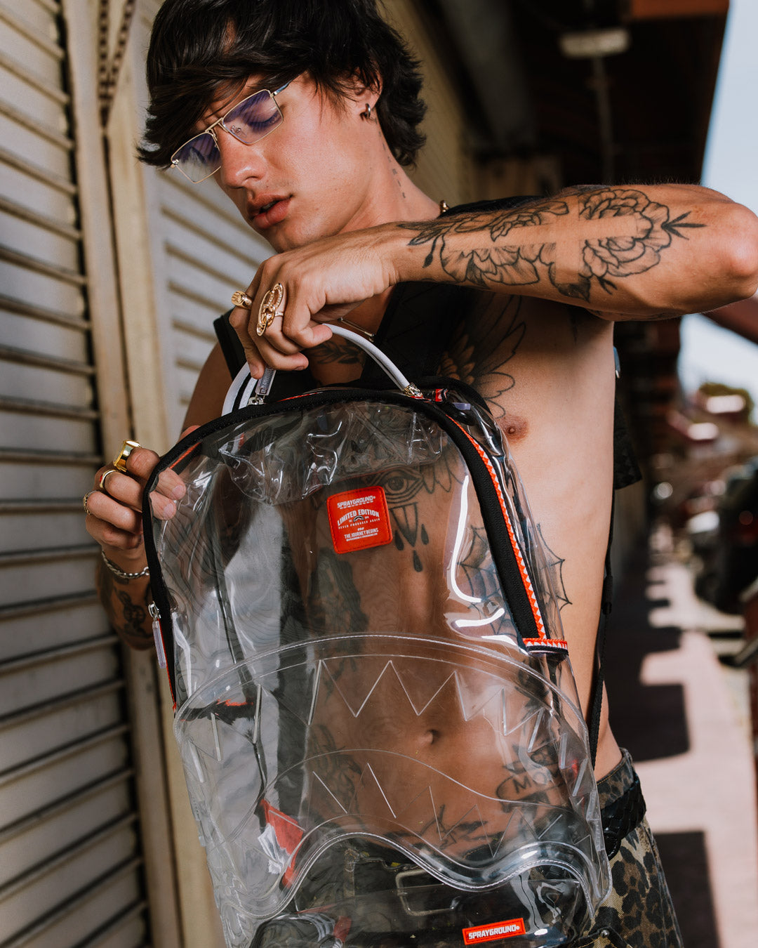 Clear Sprayground shark backpack showing front shark mouth detail and zippers