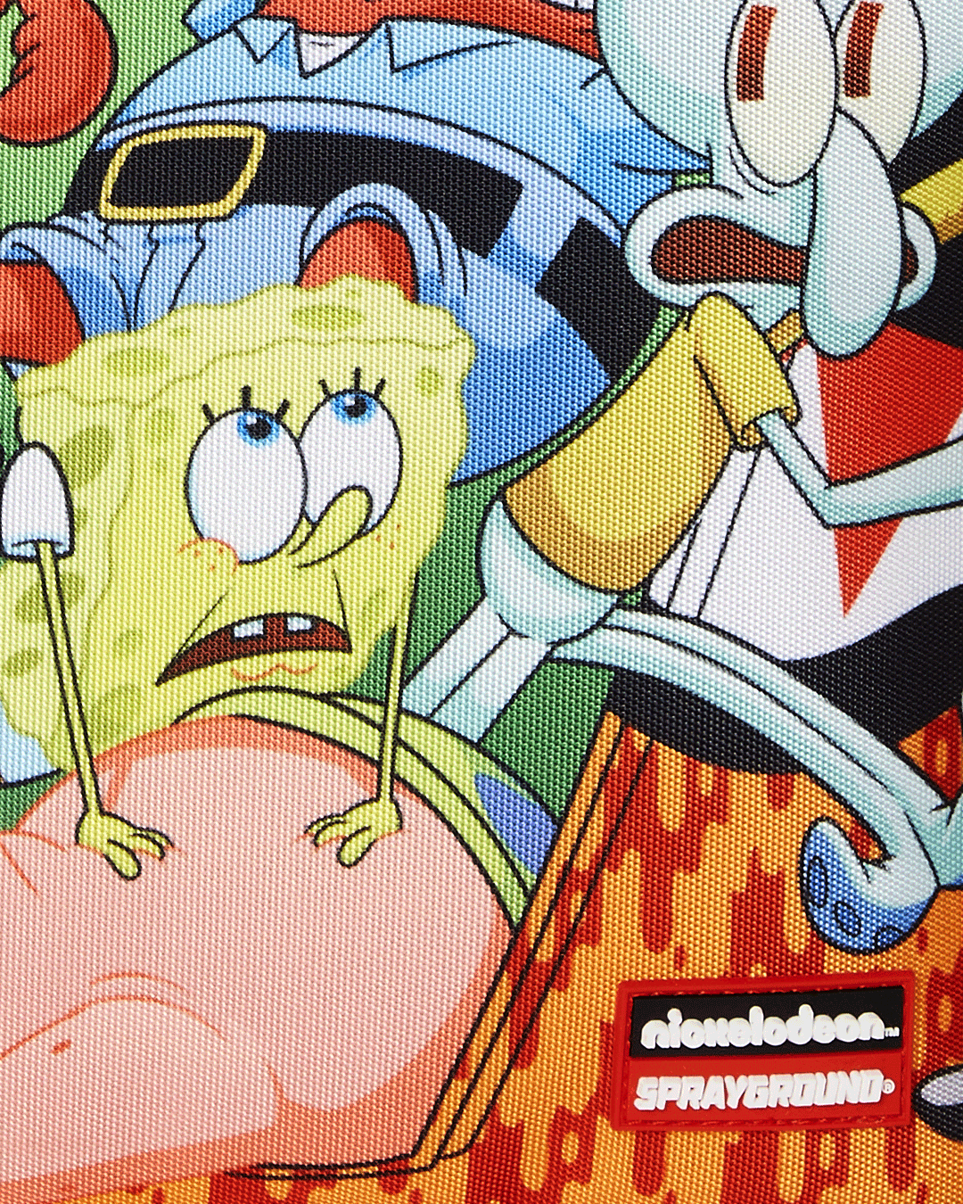 Close-up of clear sprayground backpack hardware and ergonomic back padding.