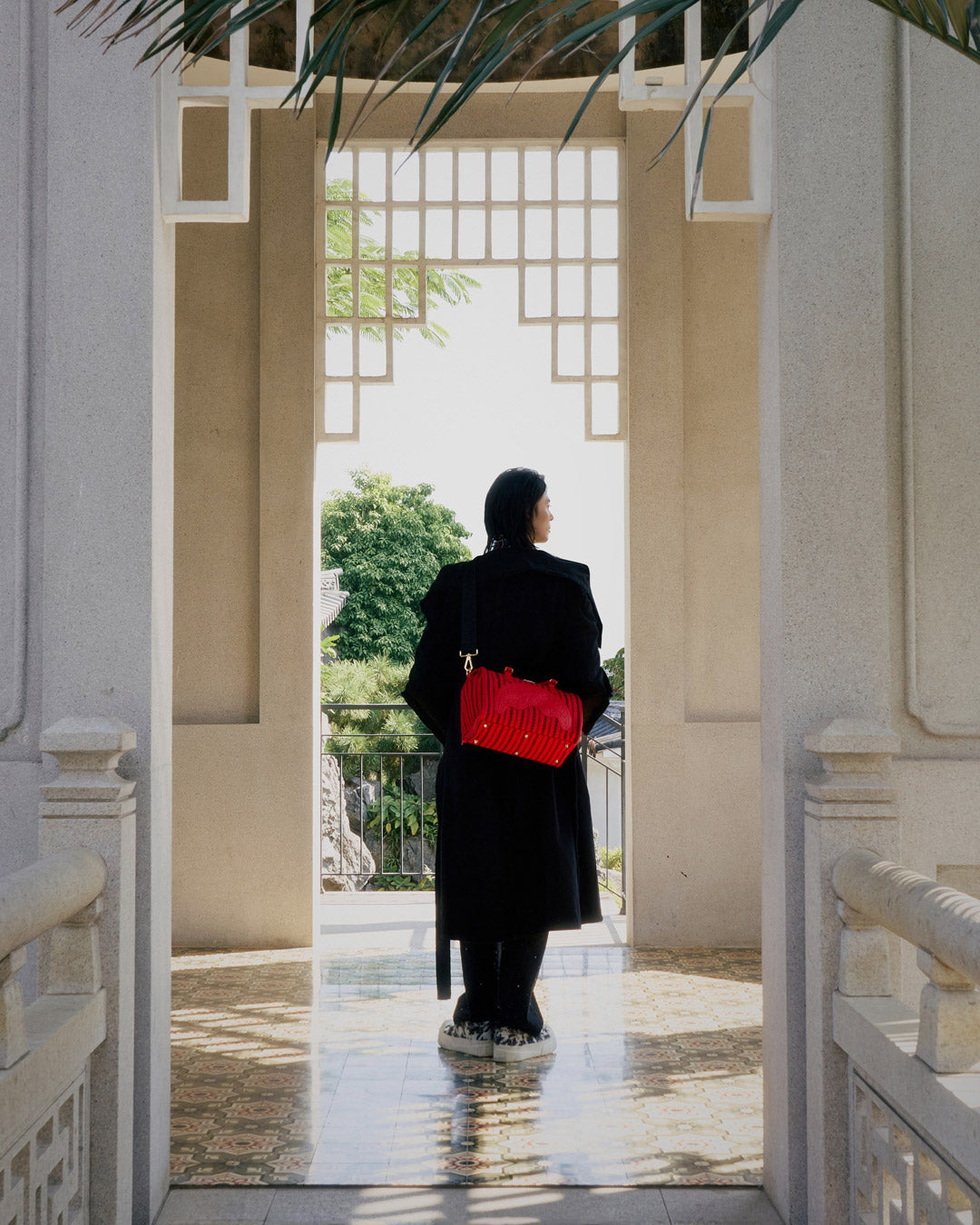 Side angle of the compact SkyChain duffle bag in natural light