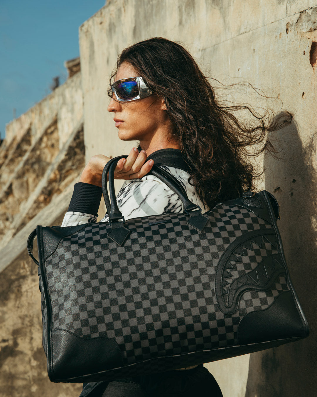 Midnight Château Faux Leather Duffle Bag being used as a golf travel bag