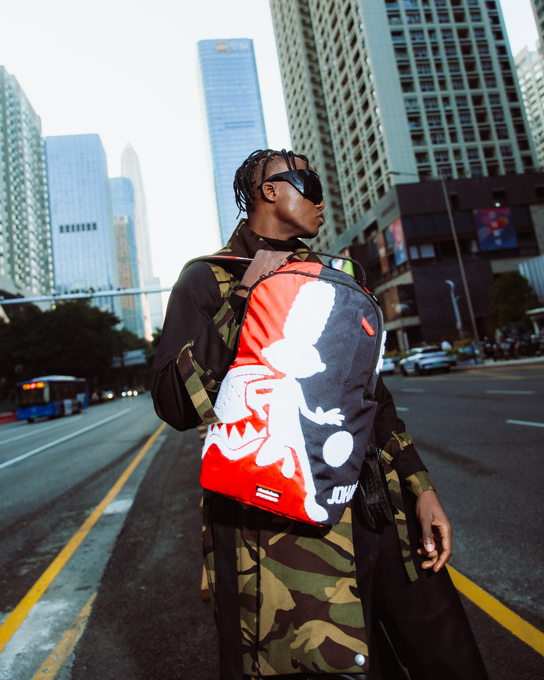 Sprayground Hey Arnold collaborative backpack side view showing ergonomic mesh back padding