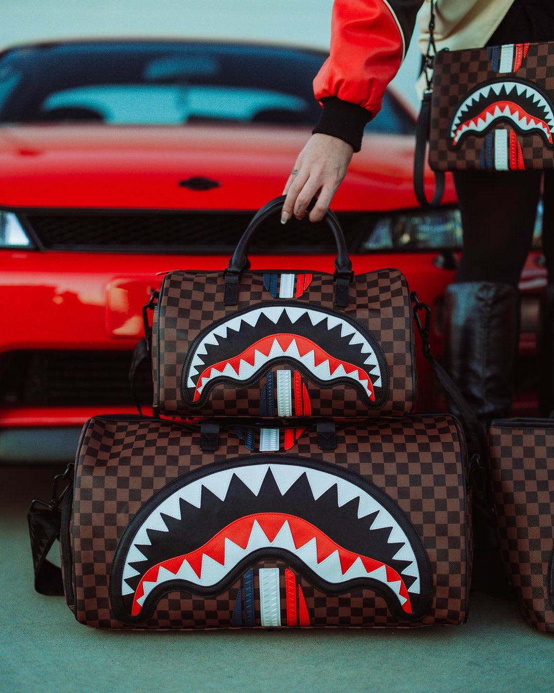 Close-up of the metal zipper pocket on the faux leather duffle.