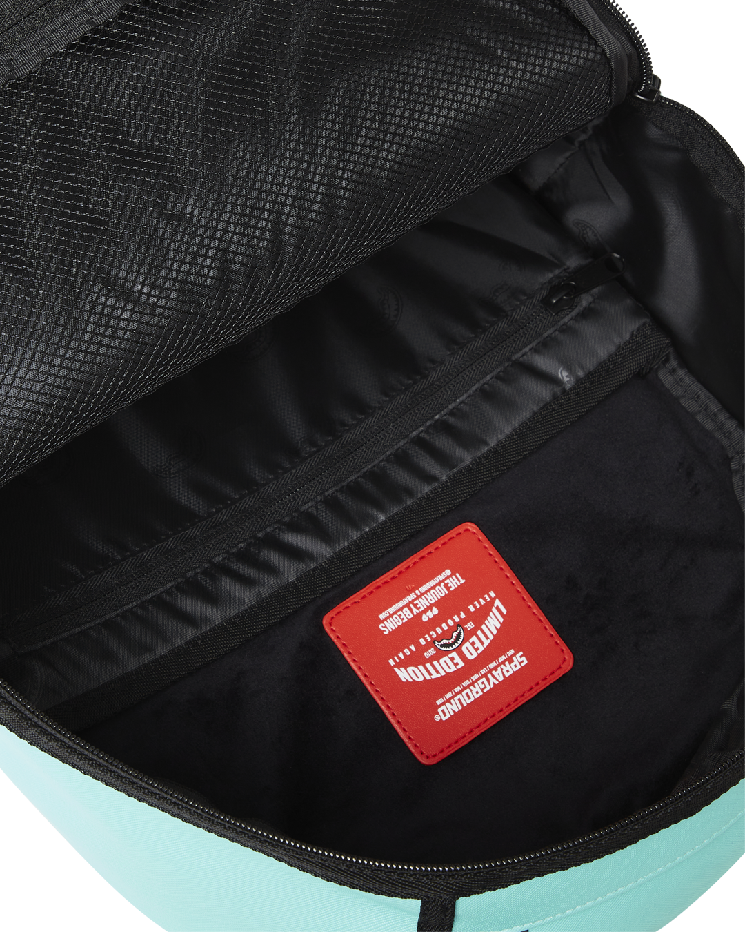 Backpack attached to rolling luggage via back sleeve, ideal for airport travel.