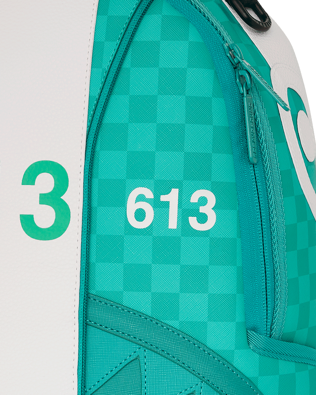 Close-up of the gold zippers and detailing on the Sharkmouth faux leather backpack.