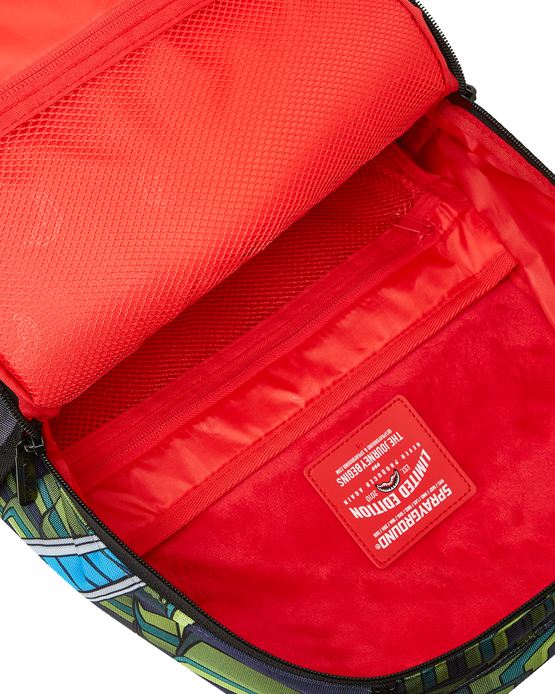 Side angle of the clear Sprayground backpack, highlighting adjustable straps and spacious pockets.
