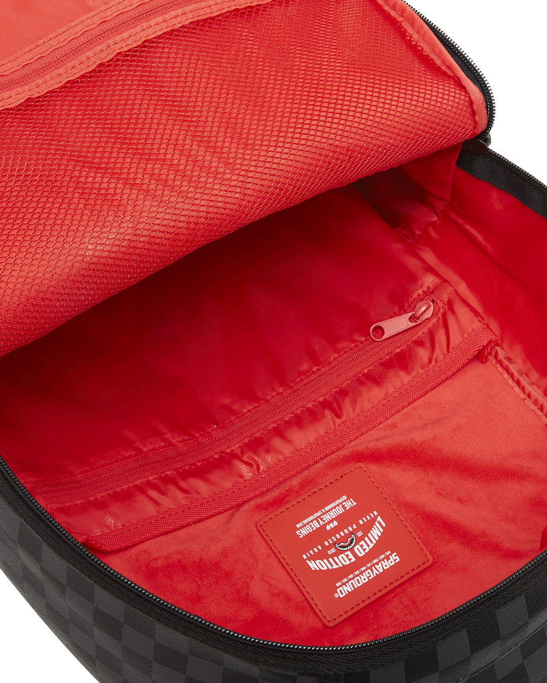 Interior shot displaying the velour laptop compartment and mesh organizer pocket