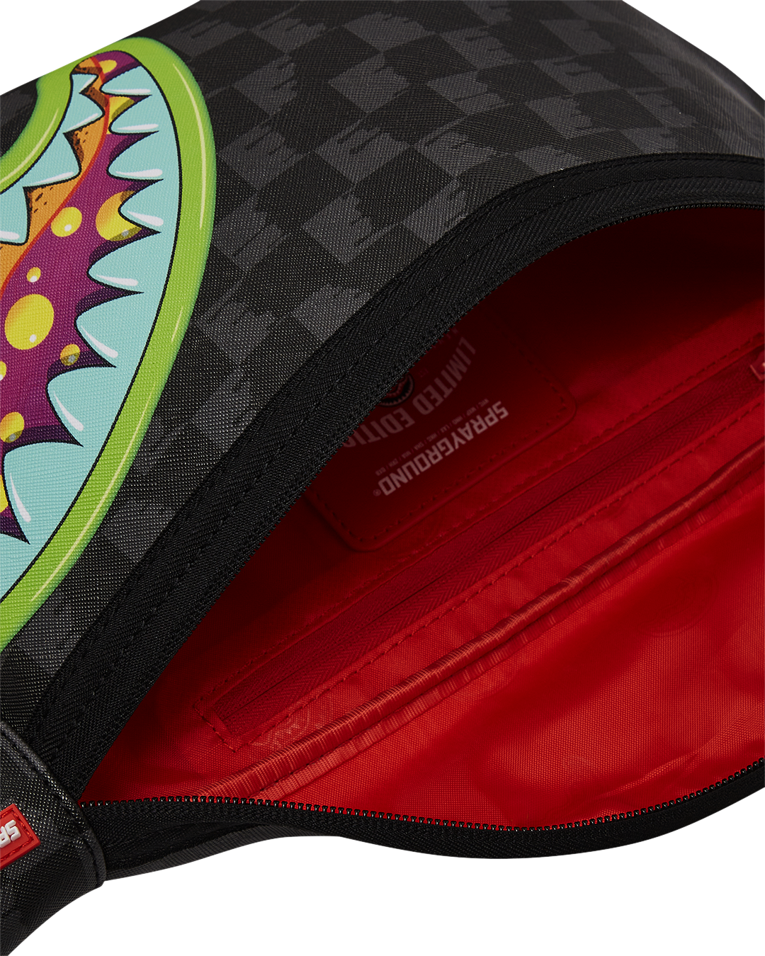 Close-up of the Savvy Luxe Leather Crossbody Bags adjustable strap and red zippered pocket.