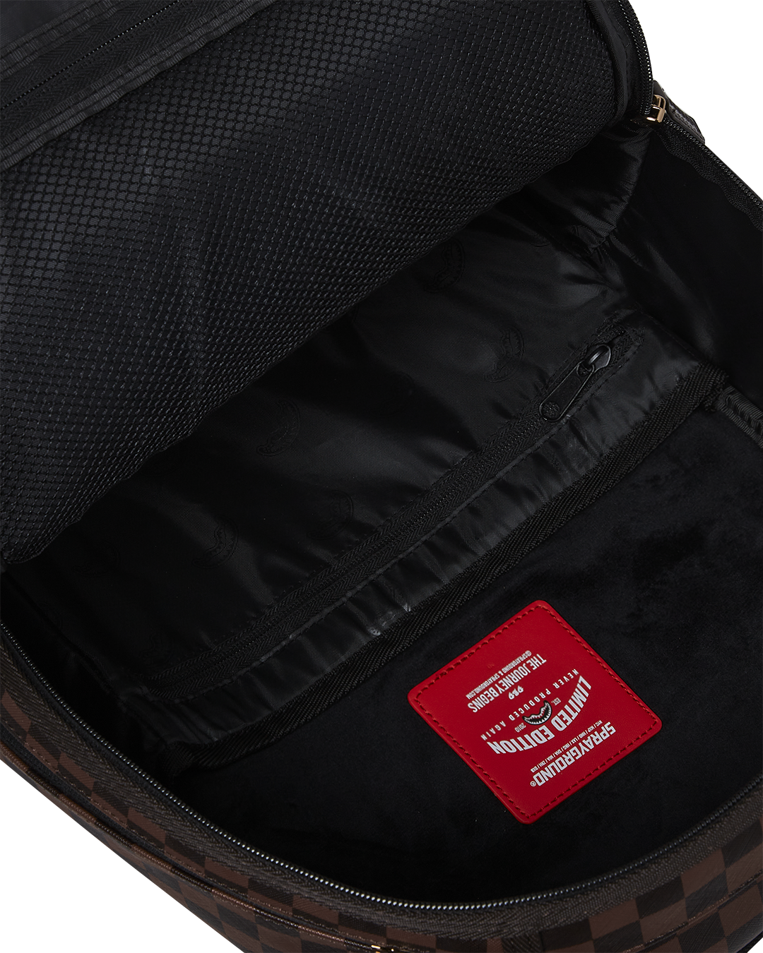 Interior shot showing the velour laptop compartment and mesh organizer in the cargo backpack