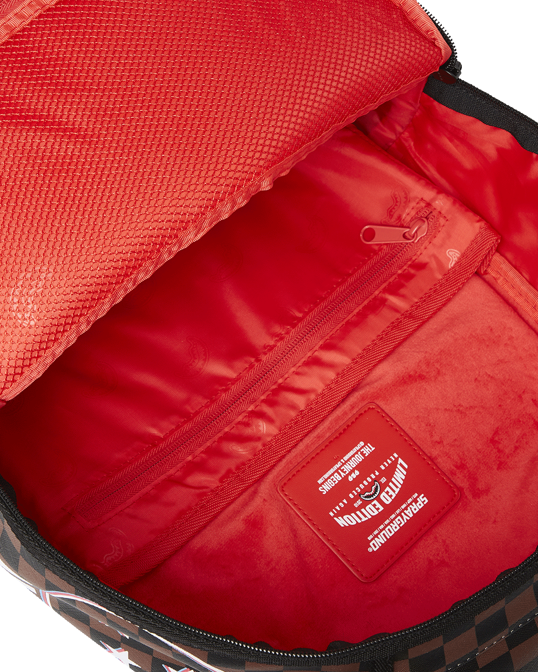 Backpacks interior showing velour laptop compartment and mesh organizer pocket
