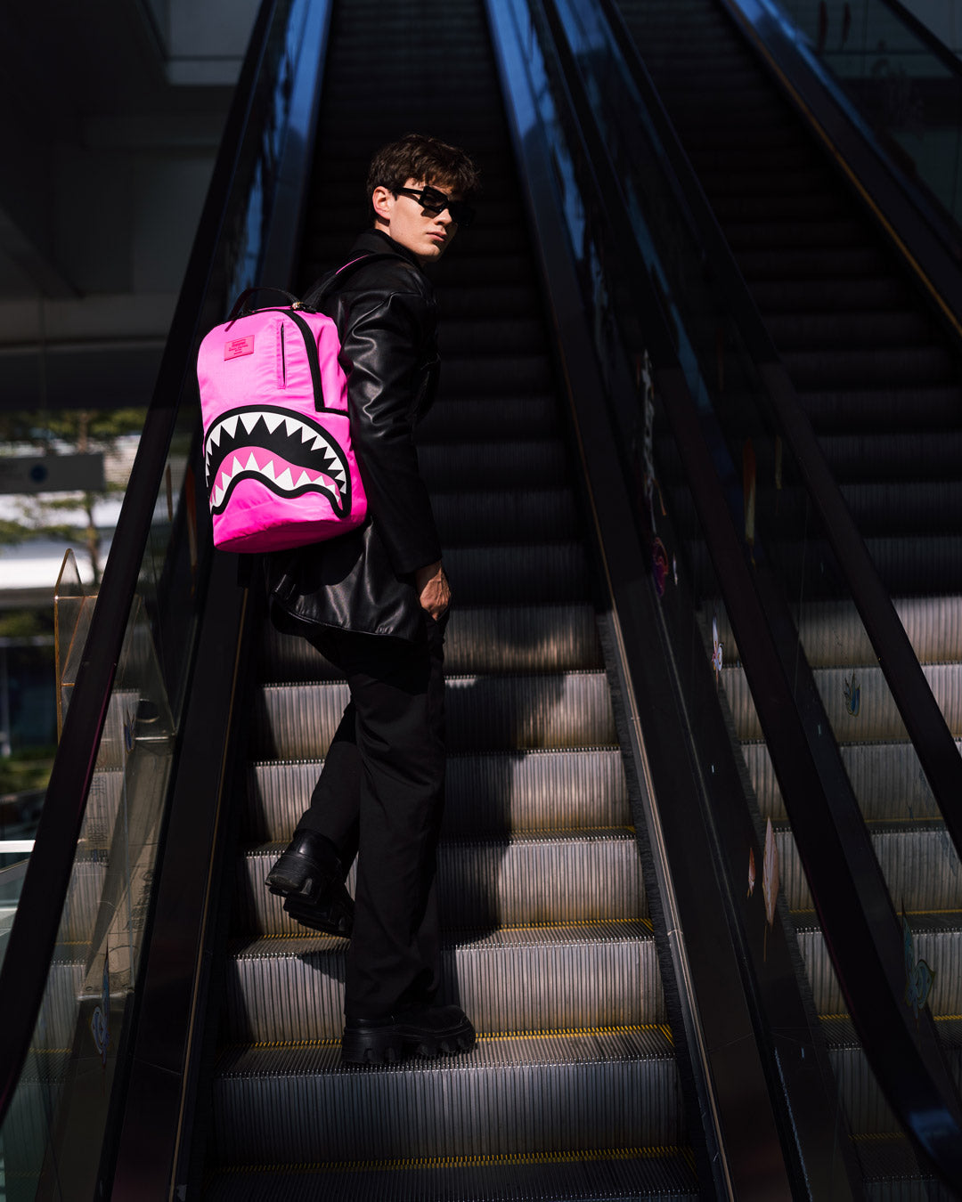 Front angle view showing backpacks gold zipper and rubber detailing