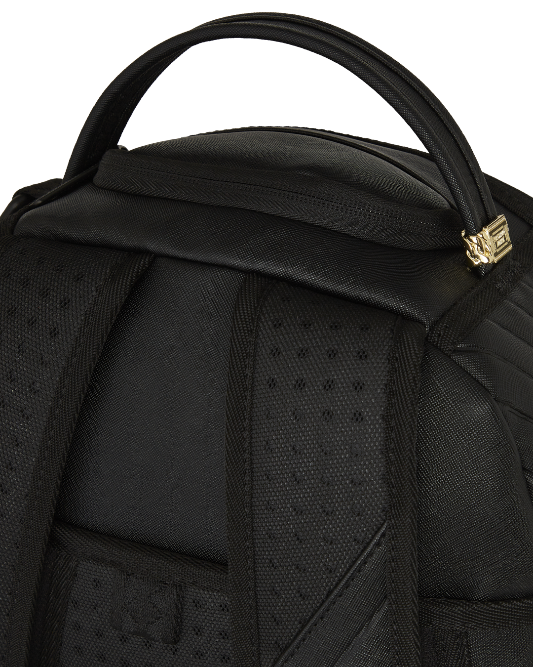 Close-up of faux leather material with metal hardware on the backpack