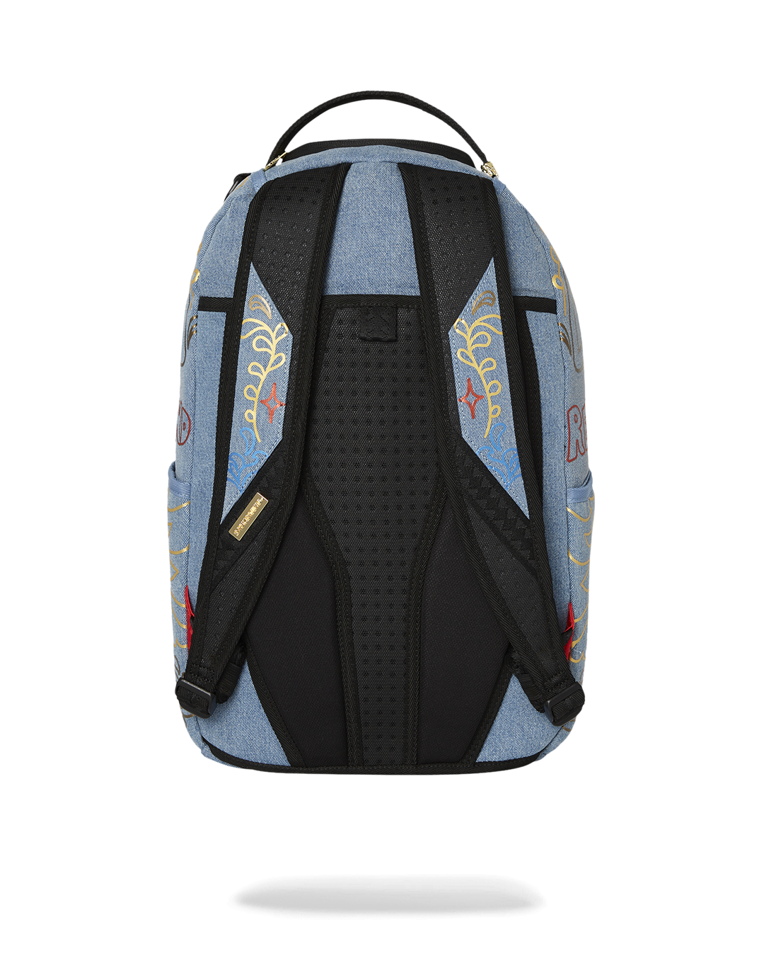 Front view showing gold zippers and denim texture on designer backpack