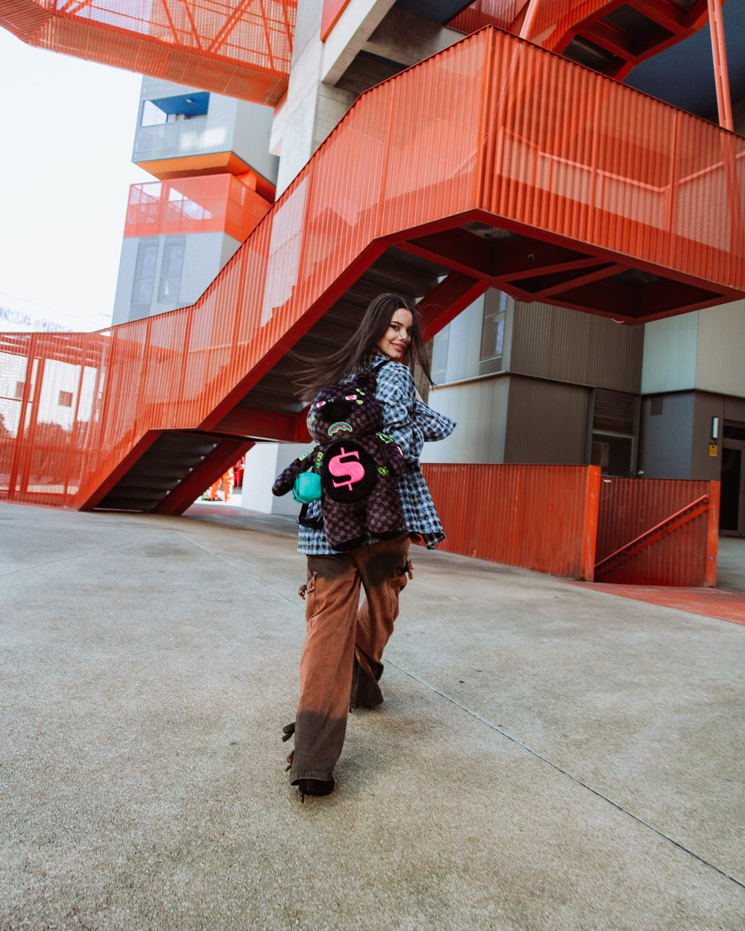 Front-facing view of sprayground teddy bear backpack limited edition featuring slime green accents.