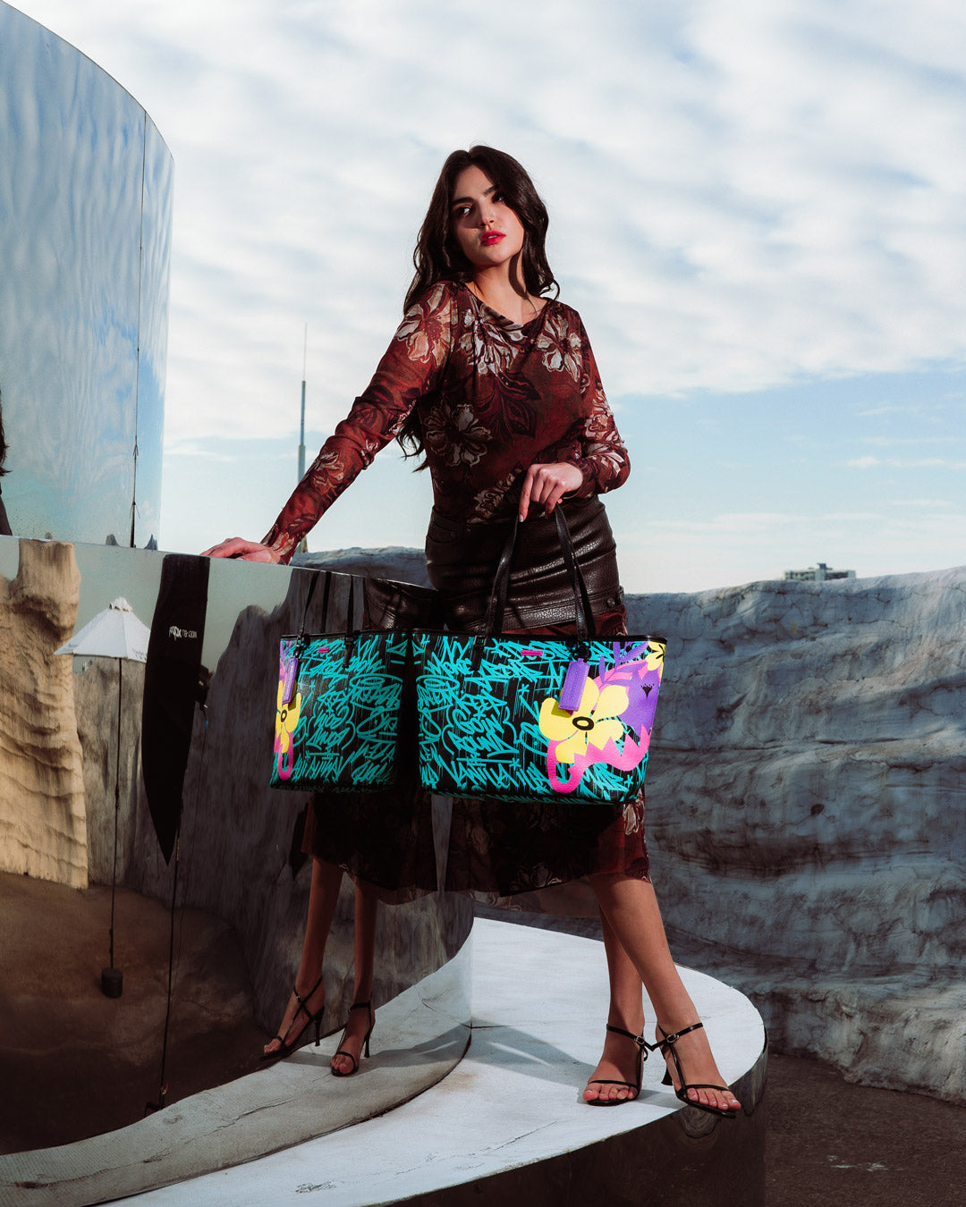 Sprayground Garden Glamour Tote held casually over the shoulder in a city setting