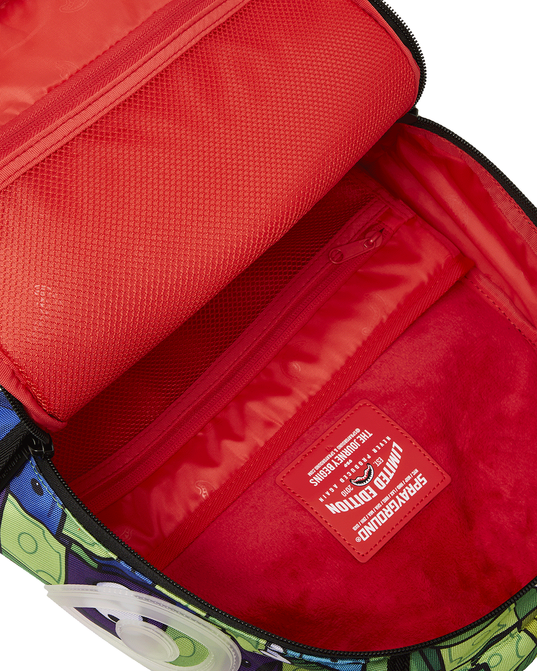 Top-down shot of velour-lined compartments for laptop and sunglasses