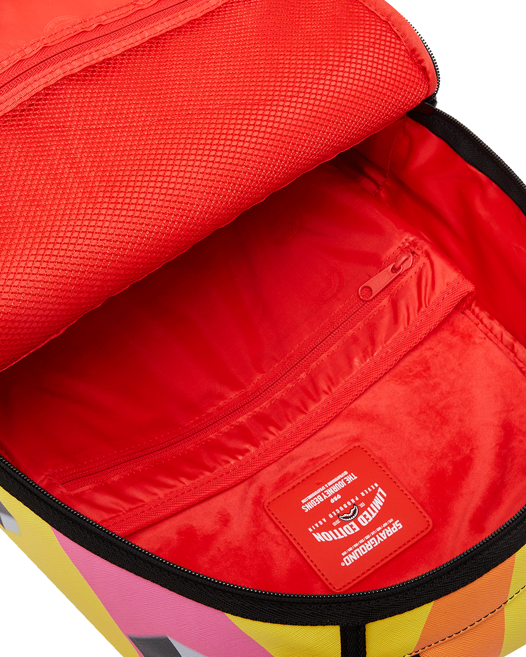 Close-up of the backpack’s zippered compartments and gold hardware