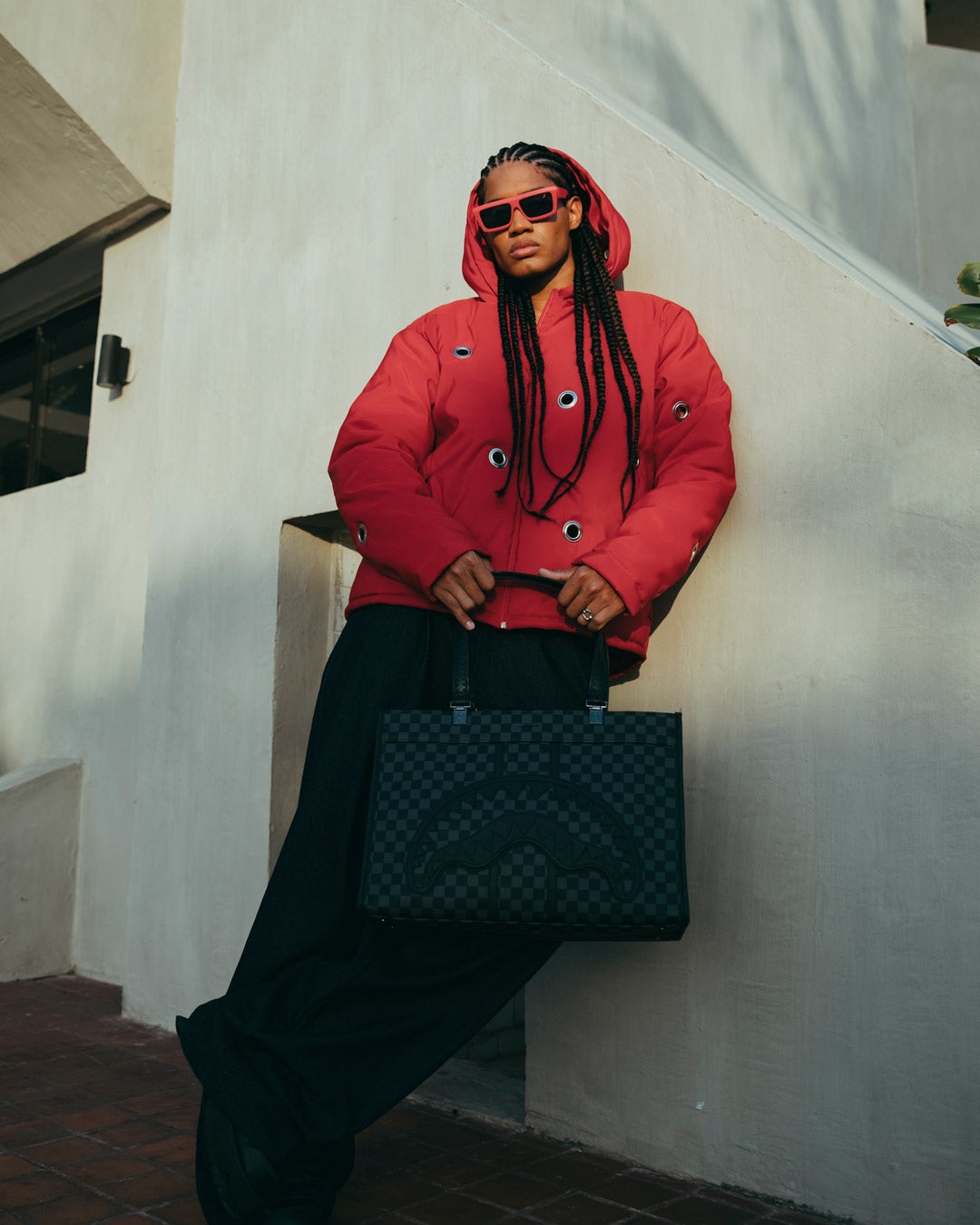 Midnight Chateau tote bag displayed on shoulder in a trendy urban environment.