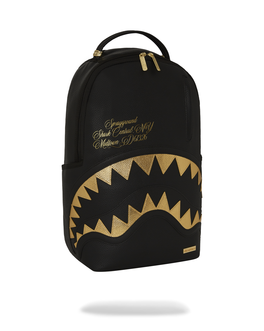 BAPE Shark backpack with faux leather finish and gold accents, interior view showing laptop compartment