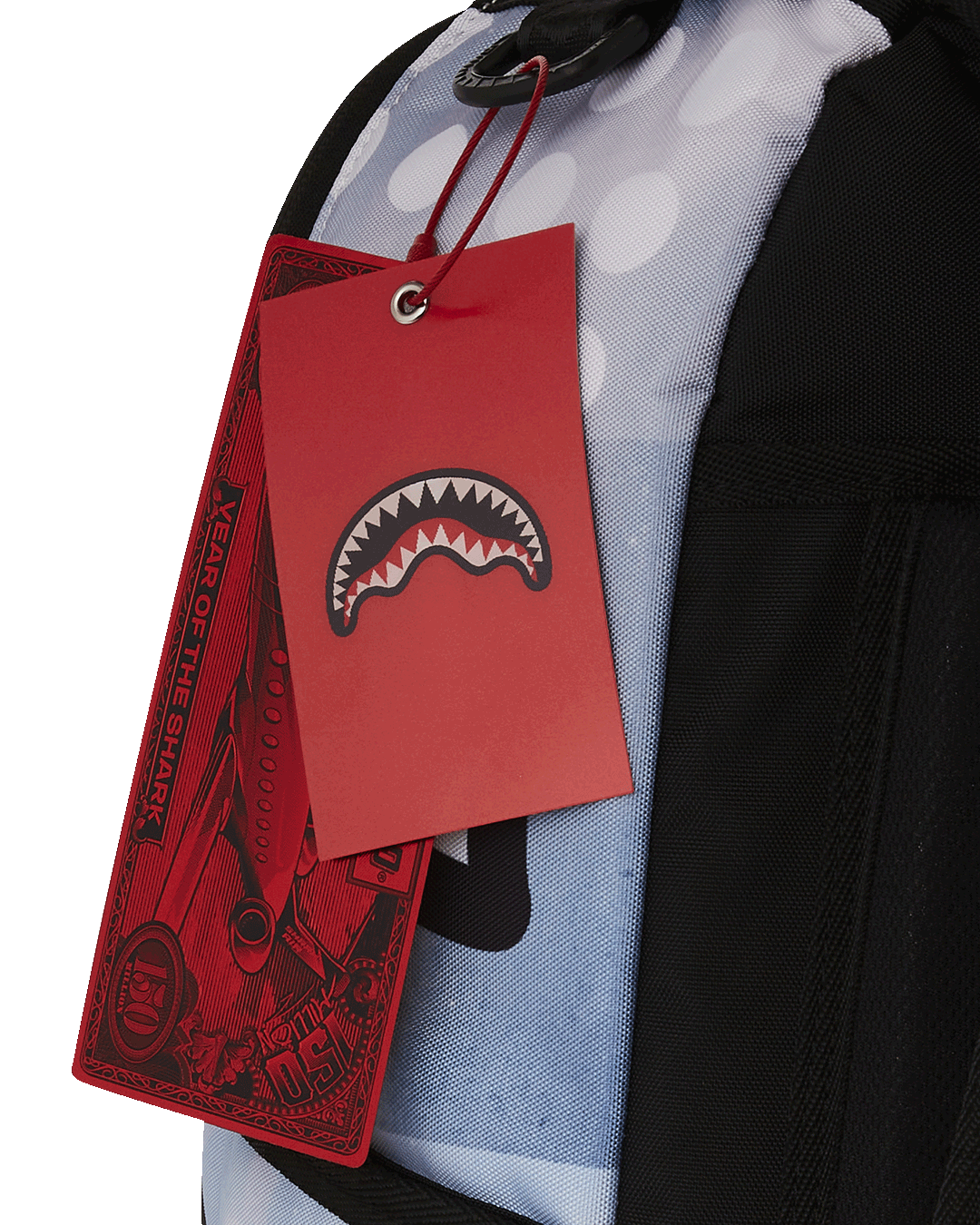 Front view of Looney Tunes backpack with gold zippers and side pockets