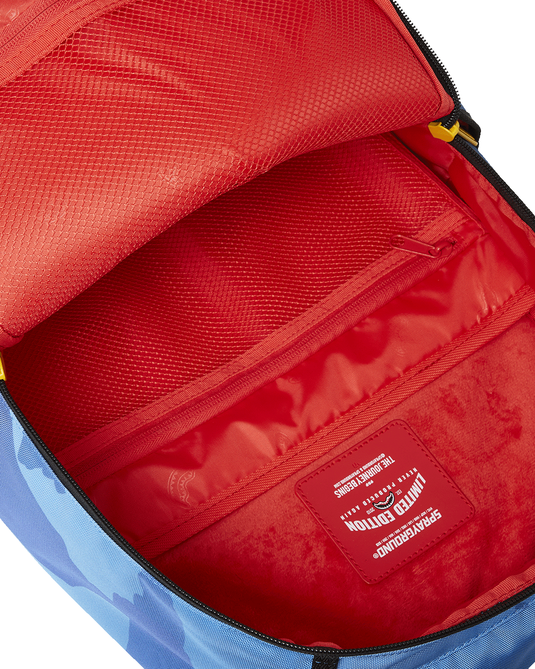 Interior of the Sprayground backpack showing velour laptop compartment.