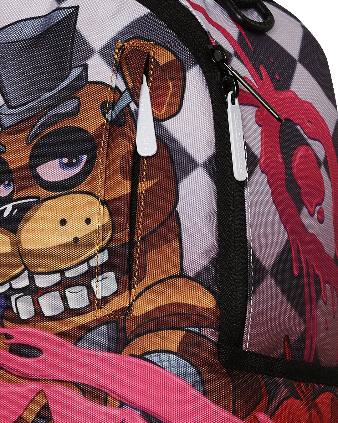 Top-down angle highlighting velour laptop sleeve and internal mesh organizer of the Sprayground backpack