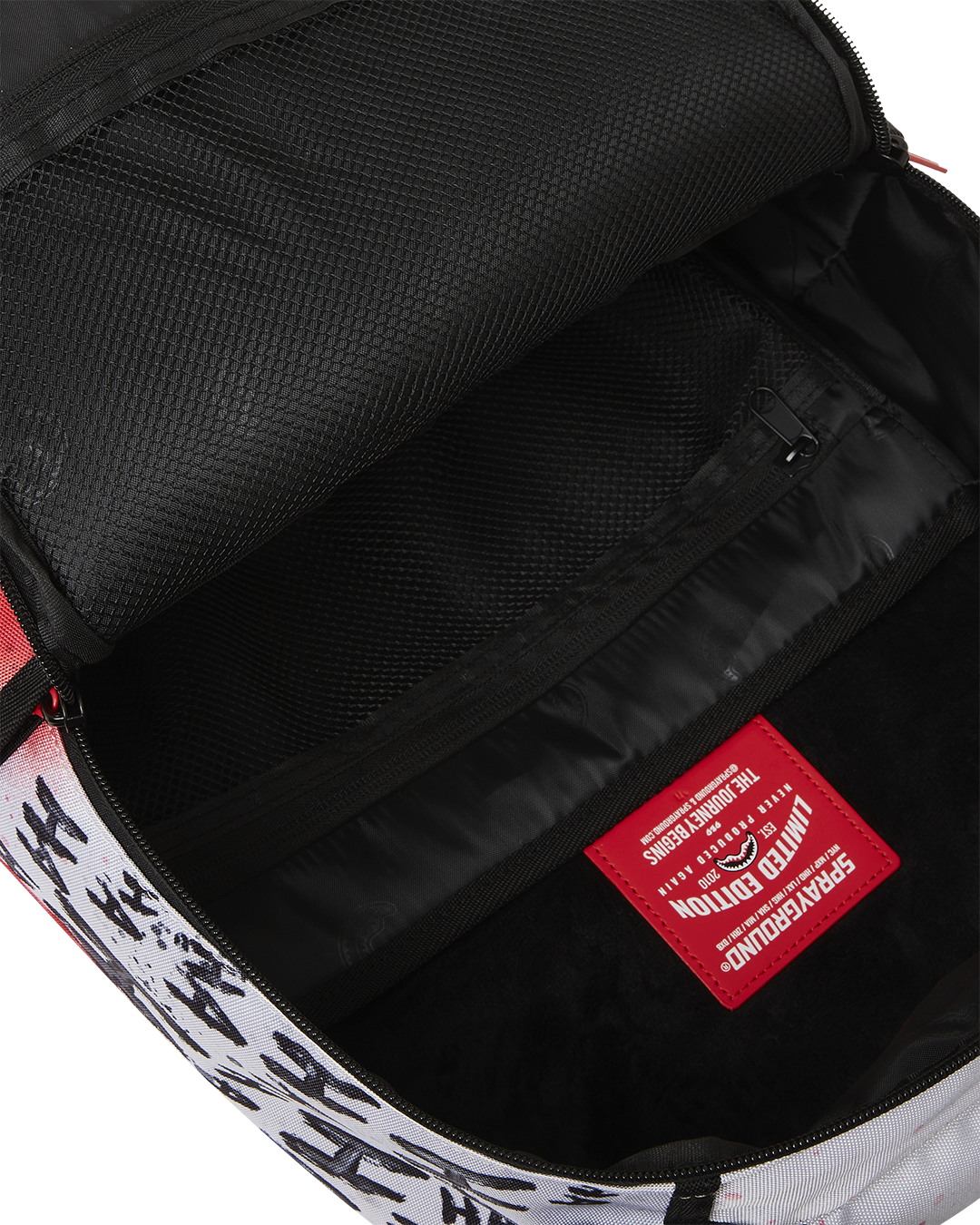 Open backpack displaying laptop sleeve and internal mesh organizer in velour