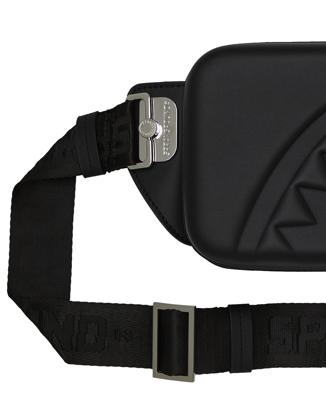 Angled shot of EVA hard-shell sling bag showing sharkmouth detail on the front panel.