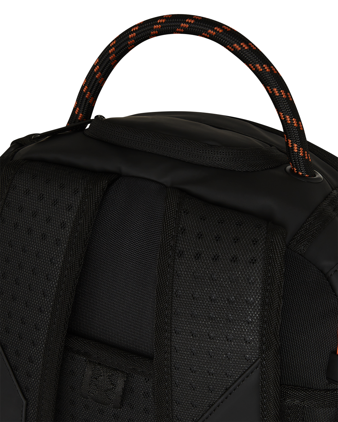 Close-up of gold zippers and metal hardware on the backpack