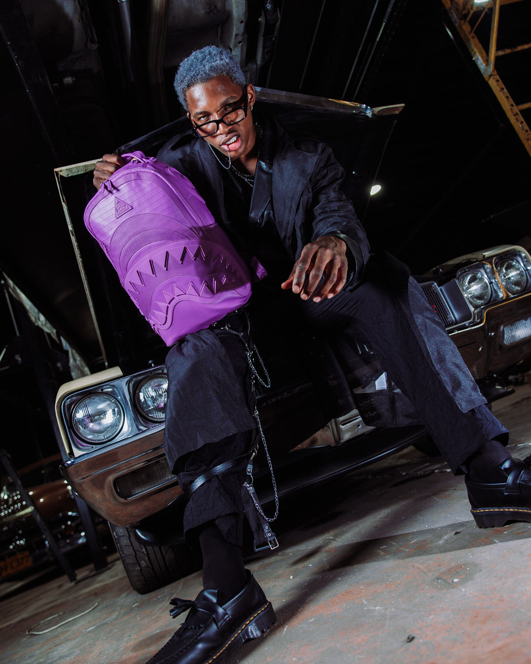 Murasaki faux leather backpack worn casually with a laptop inside