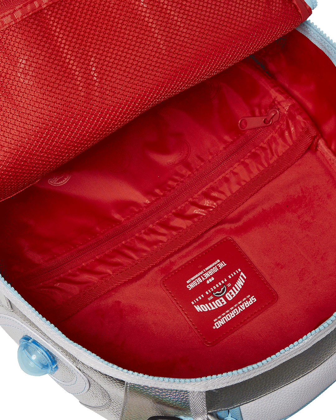 Front view of the Destiny Ghost gaming backpack with iridescent shine and plush Ghost centerpiece