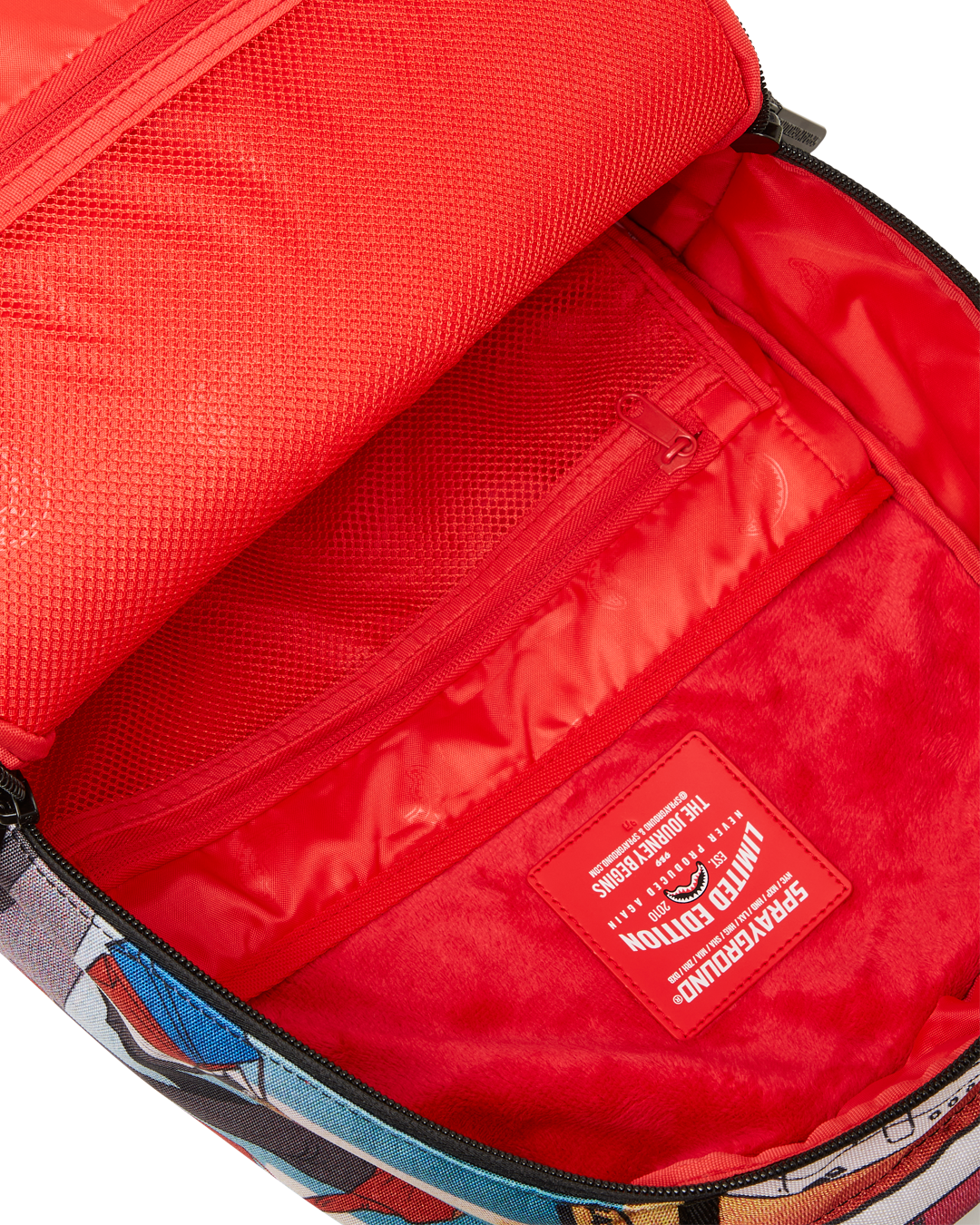 Front view of the pink Sprayground backpack with zippered pockets and bold graphics