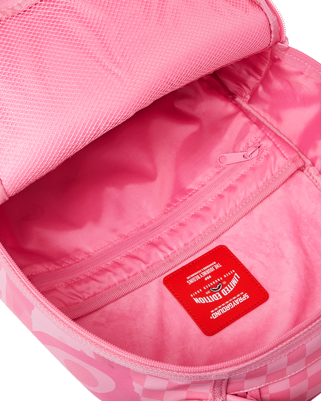 Interior laptop and sunglass compartments of designer backpack