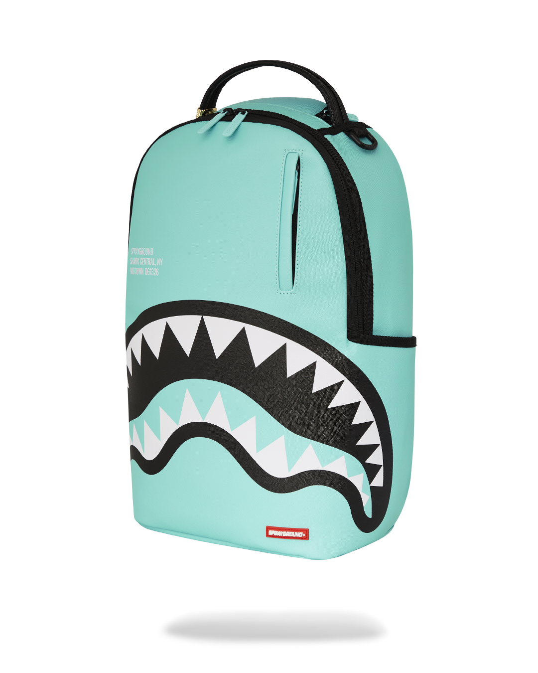 Backpack attached to rolling luggage via back sleeve, ideal for airport travel.