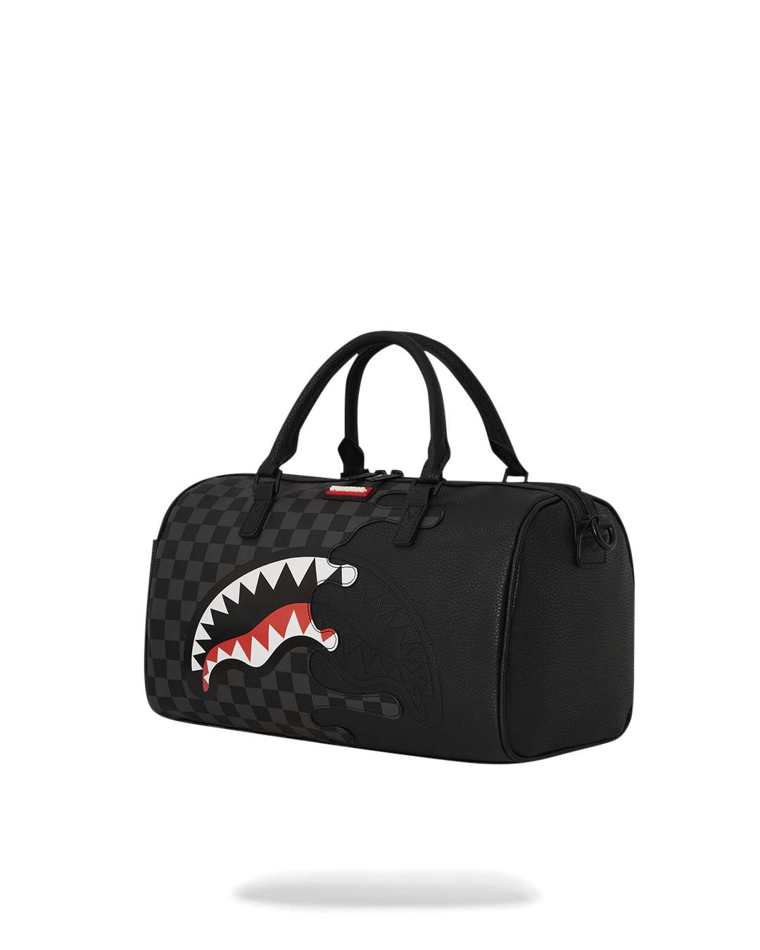 Side view of the mini duffle bag with crossbody strap and interior pockets.