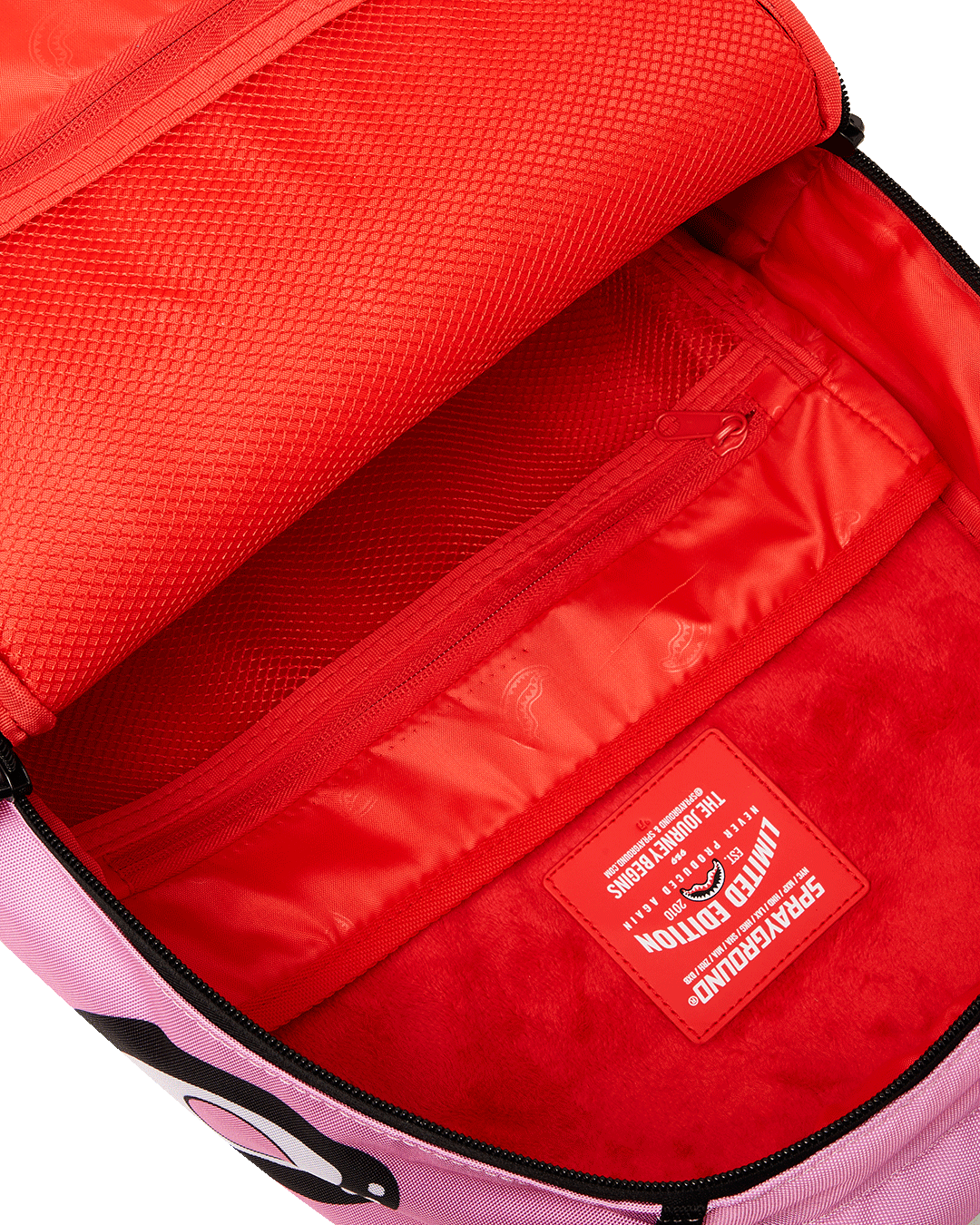Sakura laptop bag for women attached to carry-on handle during airport travel