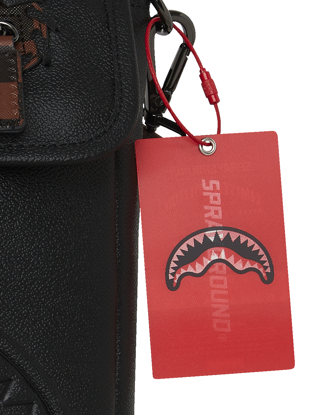 Adjustable strap of the Checkpoint Royale crossbody bag displayed against a backdrop.