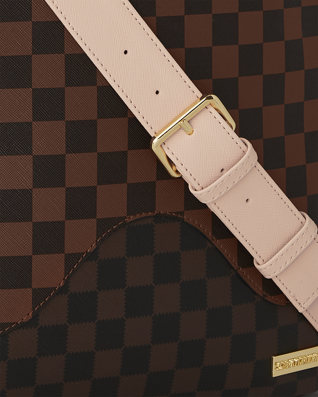 Faux leather backpack with gold zippers and multiple compartments, ideal for travel