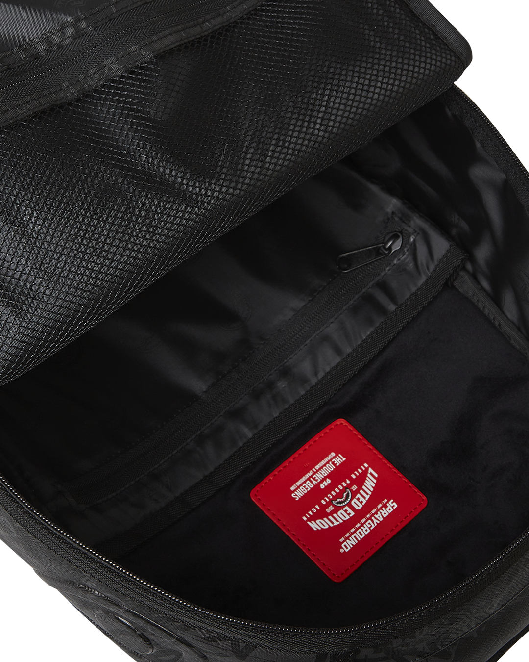Close-up of the faux leather material and gold zippers with metal hardware