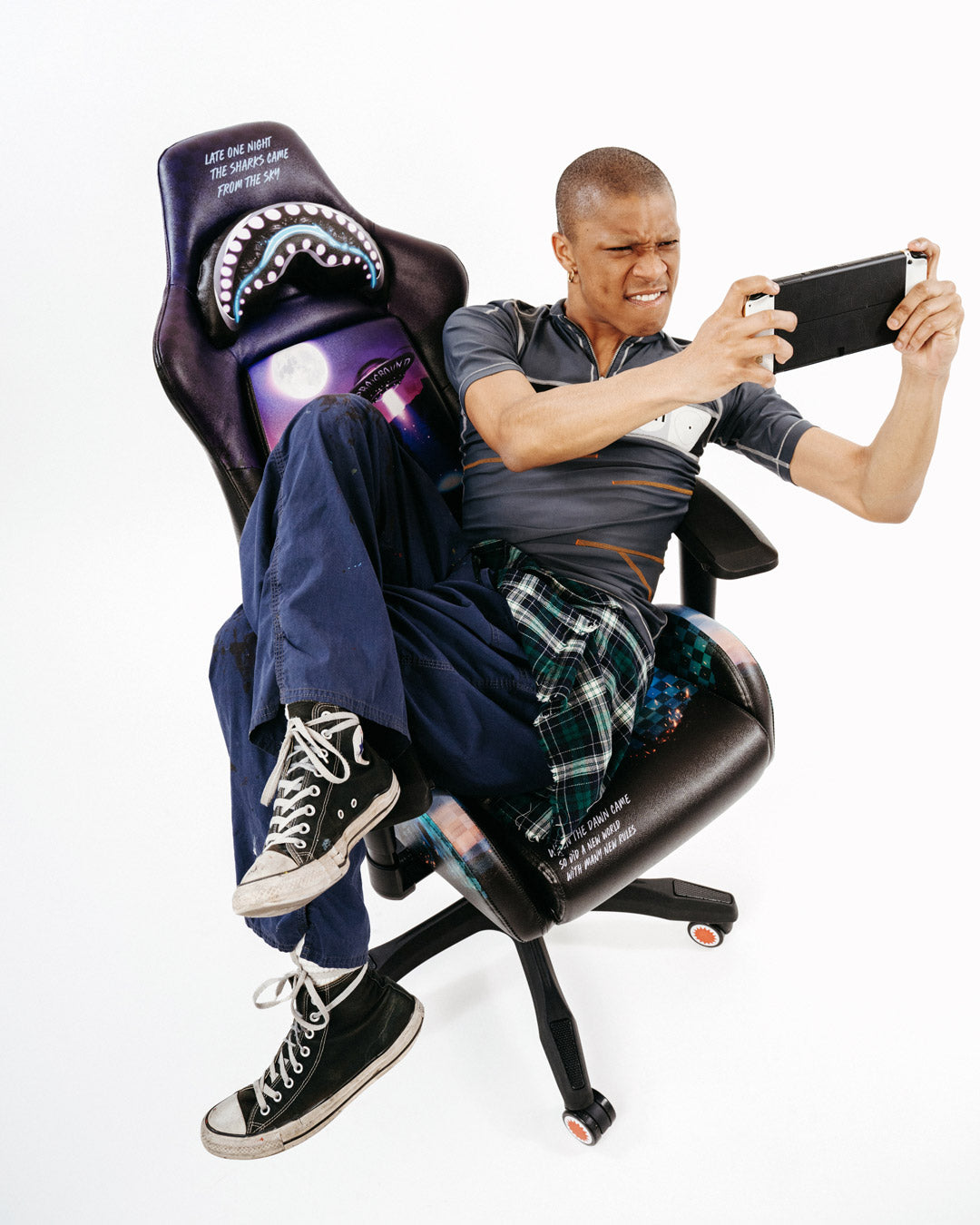 Front view of the ergonomic gaming chair showcasing 4D armrests and headrest pillow