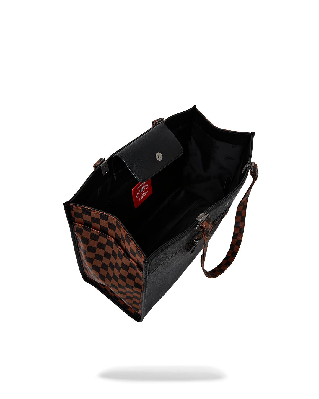 Interior compartments of designer tote bag with laptop sleeve visible
