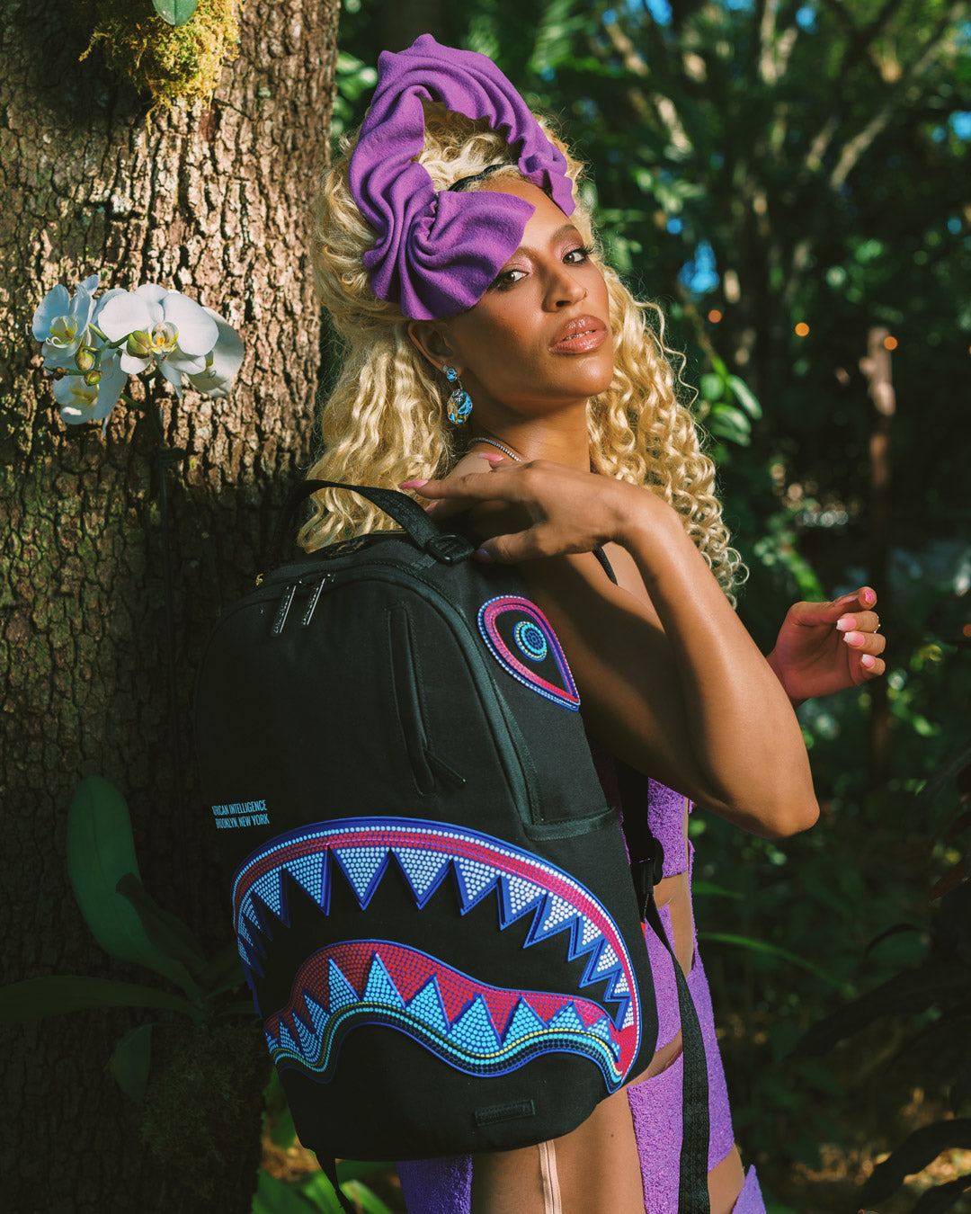 Side pocket detail showing Sprayground’s signature zipper design