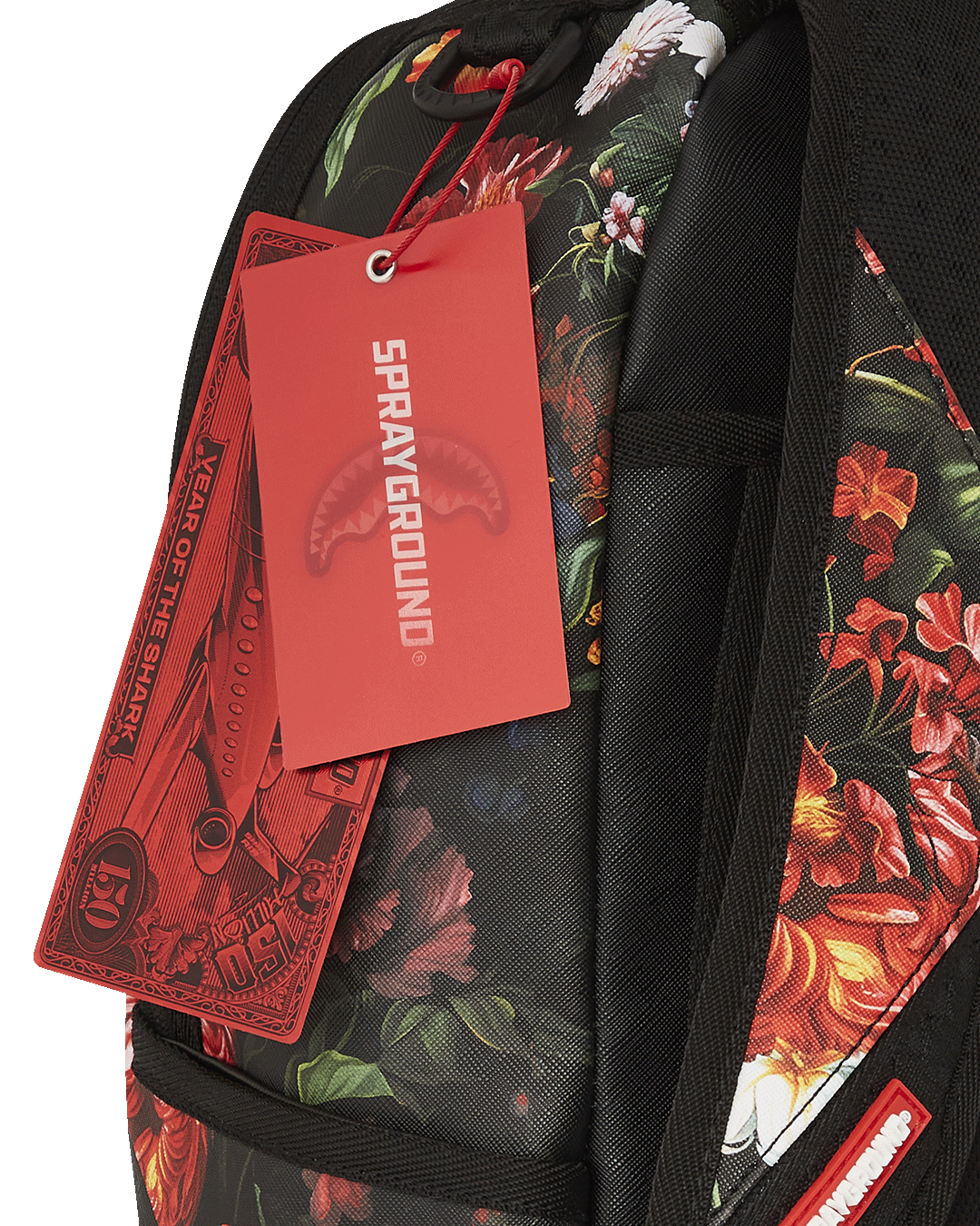 Sprayground faux leather backpack worn by a woman in an urban setting